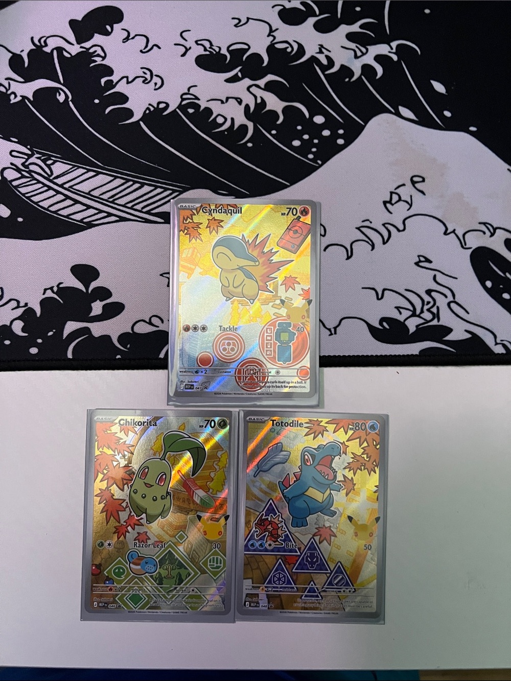 Freshly pulled series 2 promo Pokémon cards totodile, Cyndaquil, and chikorita